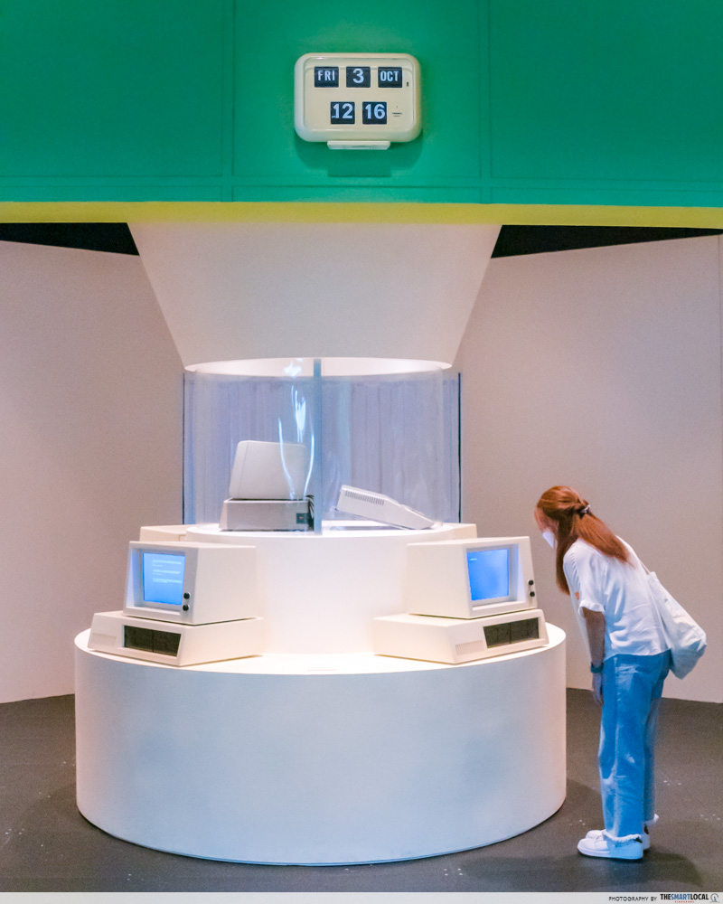 girl looking at IBM computer on display