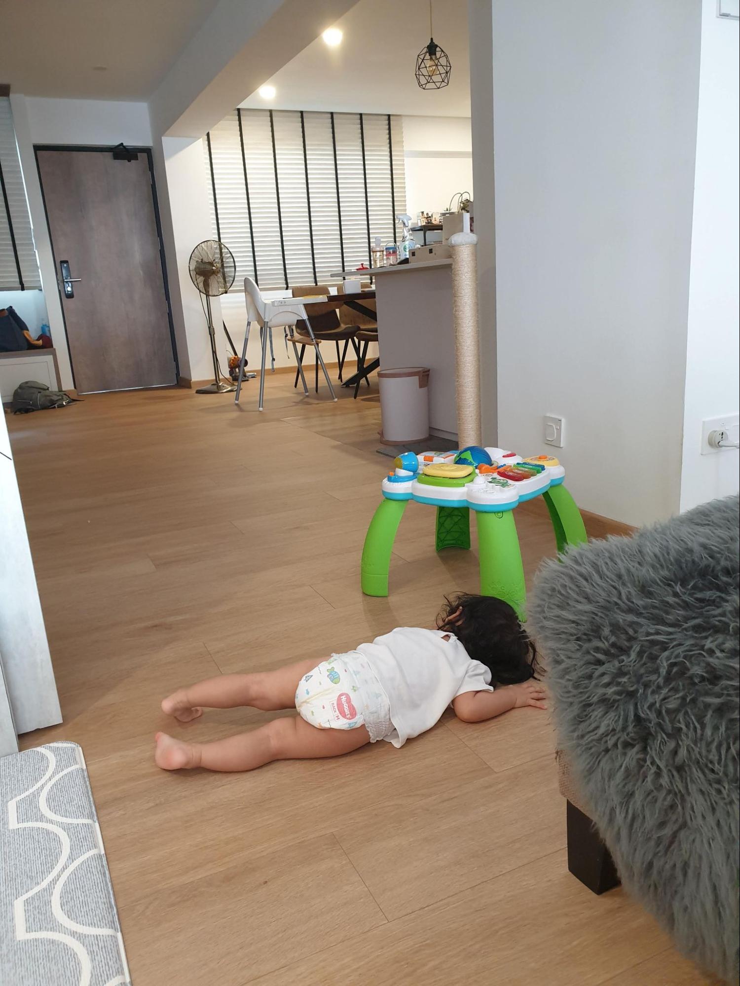 Baby lying down on the floor