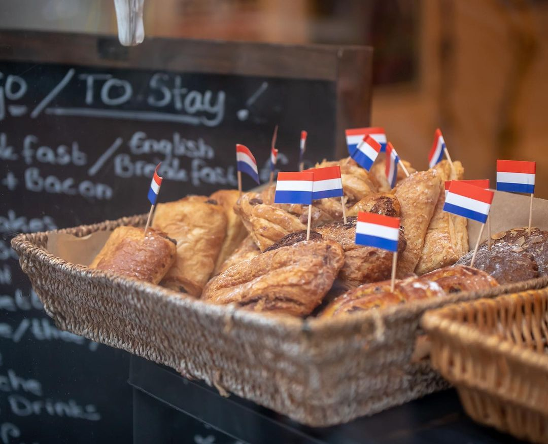 Europe money-saving travel hacks - French pastries in bakery 