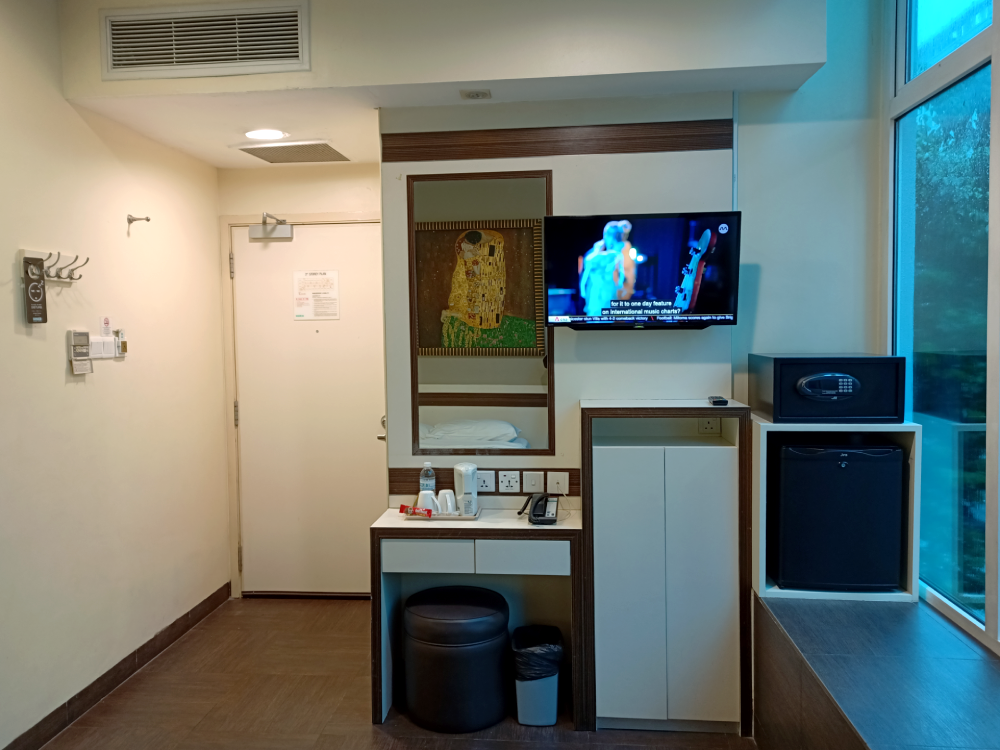 Hotel 81 Room Amenities - TV, Mini Fridge, Safe
