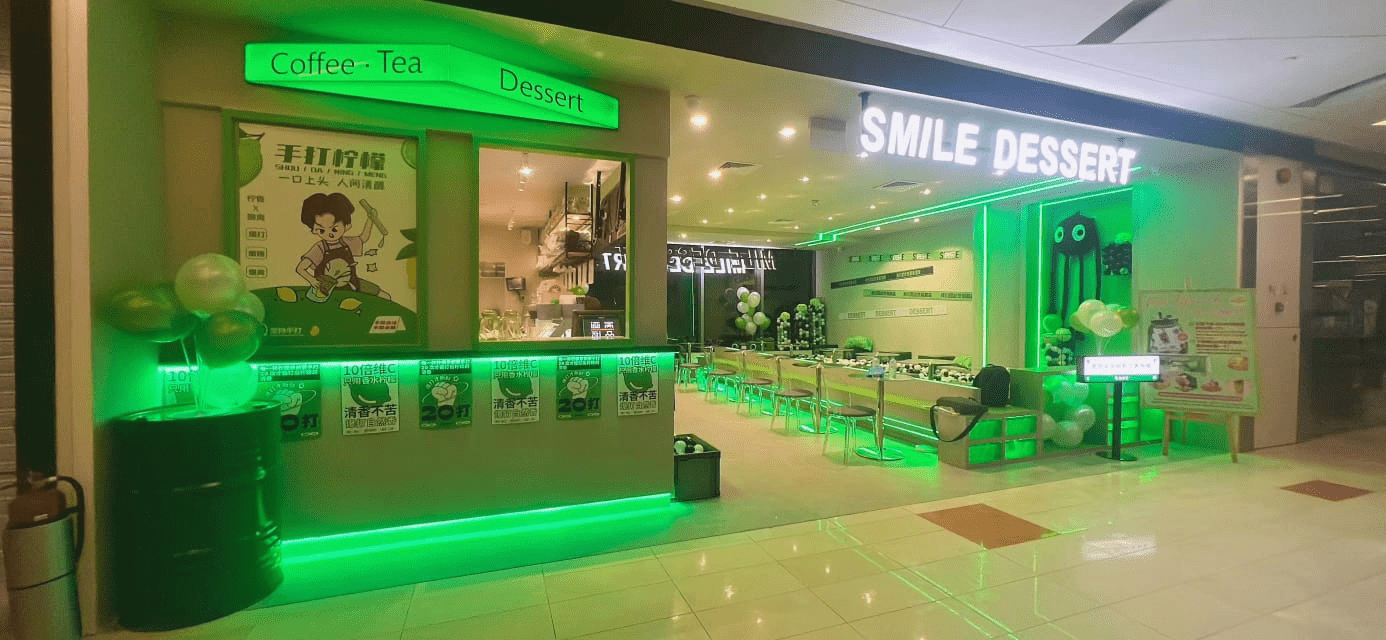 colour-themed cafes - smile dessert green storefront