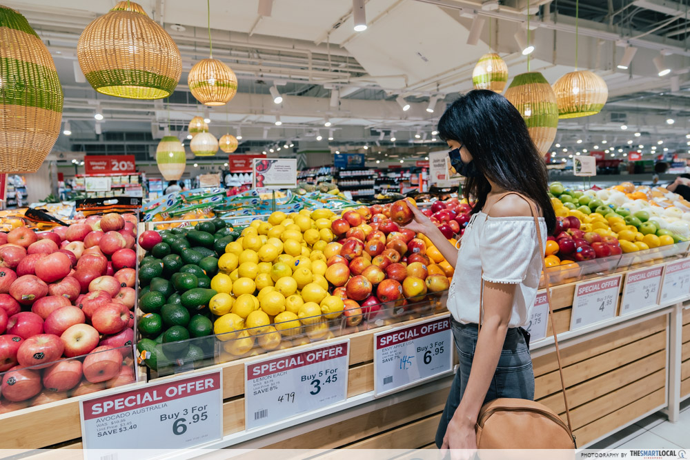 debunking cooking misconceptions girl looking at fruits in the supermarket