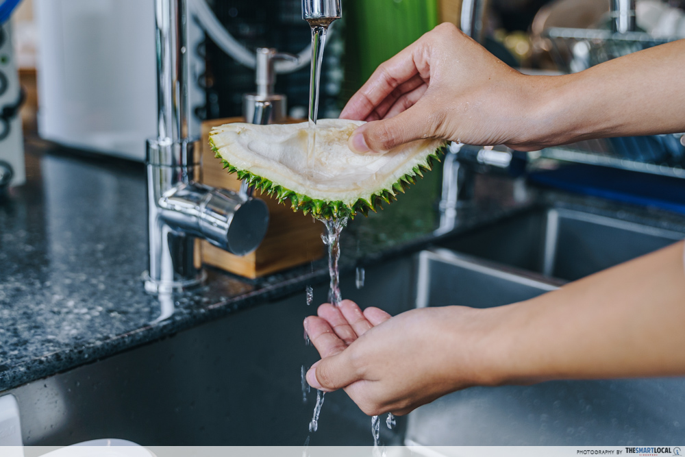 durian myths - washing hands with durian husk