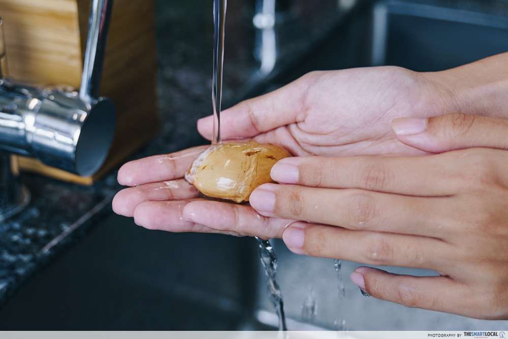 durian myths - washing hands with durian seed