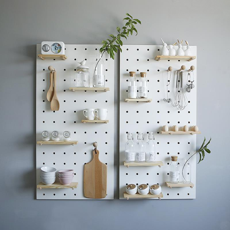 kitchen pegboard with cutlery and shelves
