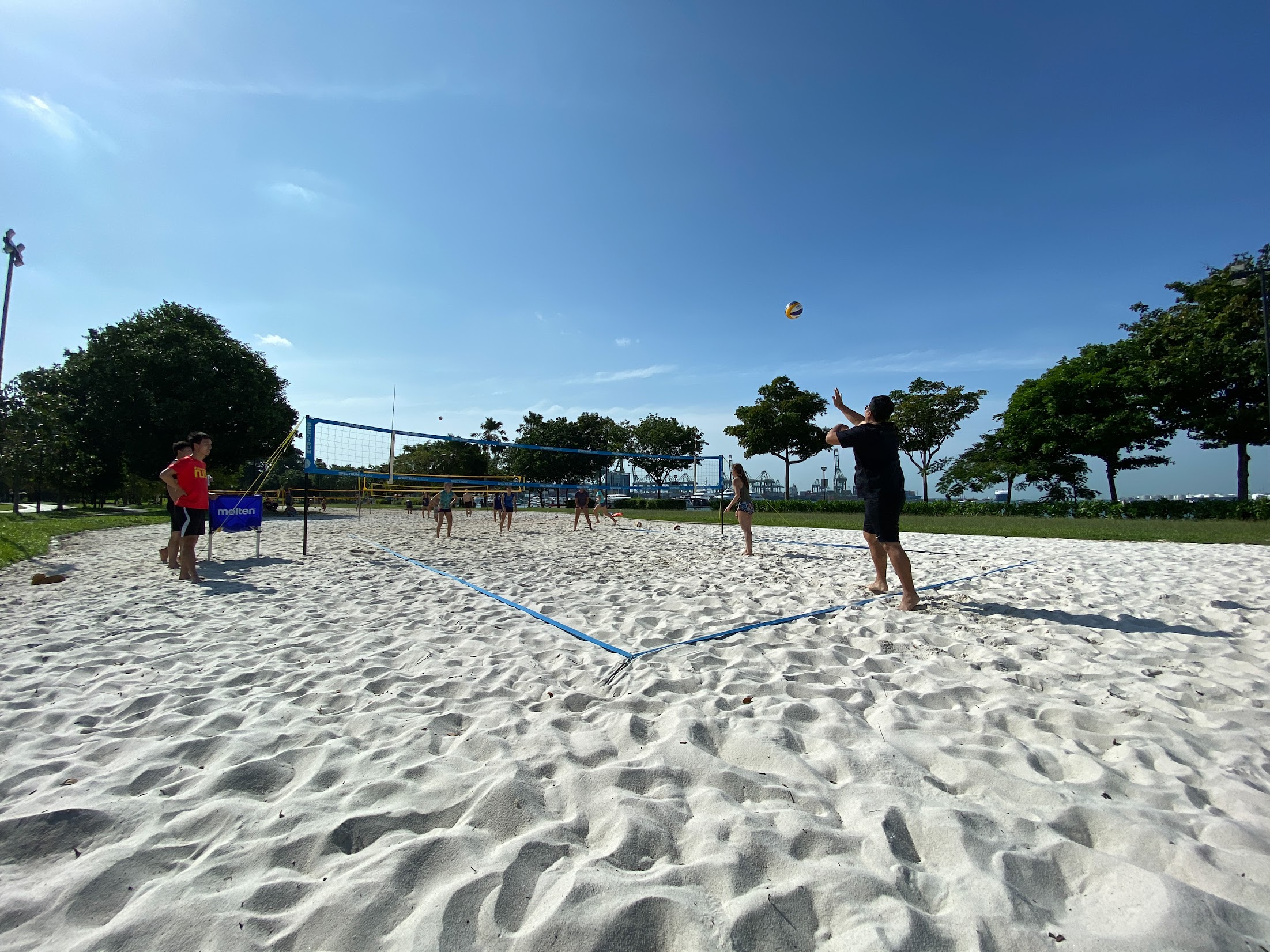 people playing beach volley ball at west coast park