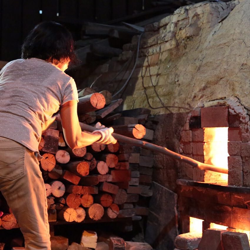 Putting Firewood Into The Dragon Kiln