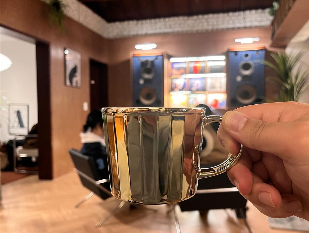 10 Unique Cafes In Seoul - cup held in House of Vinyl 