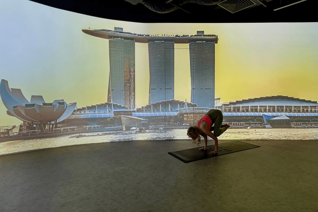 Spirit Stretch- talent holding pose behind MBS projection