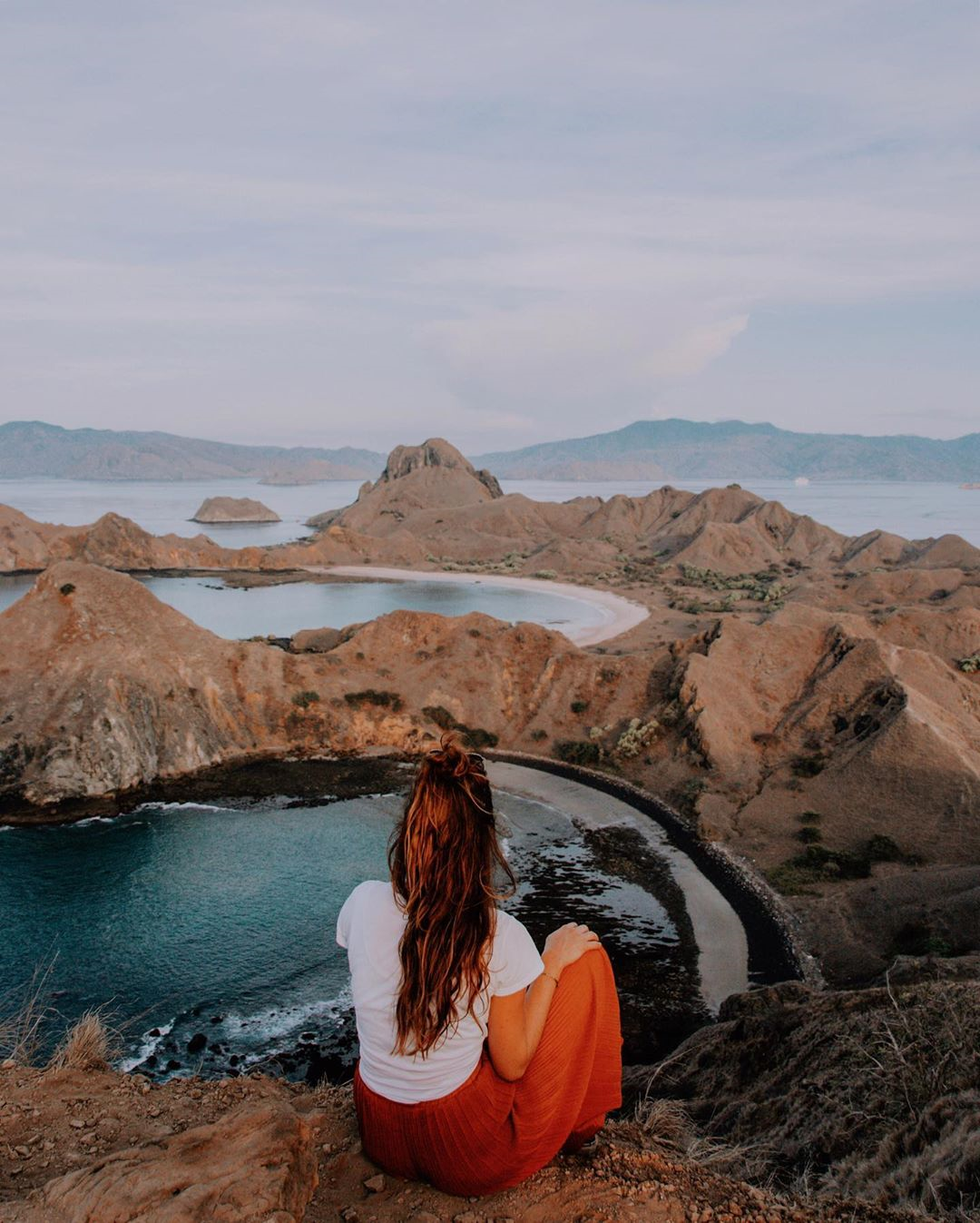 Easy hiking trails in Indonesia - Woman seeing Padar Island view 
