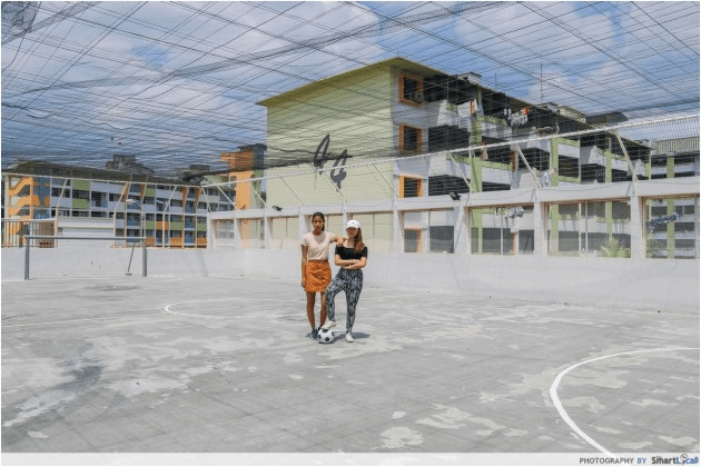 Futsal courts in SG - 2 woman on rooftop court