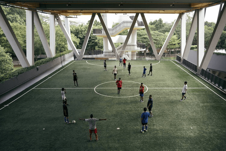 Futsal courts in SG - People playing under sheltered futsal court 