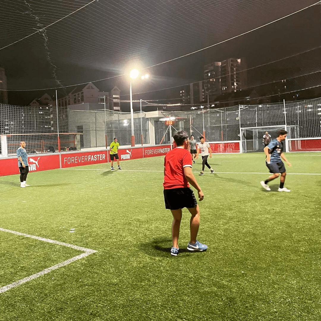 Futsal courts in SG - People playing during nightime