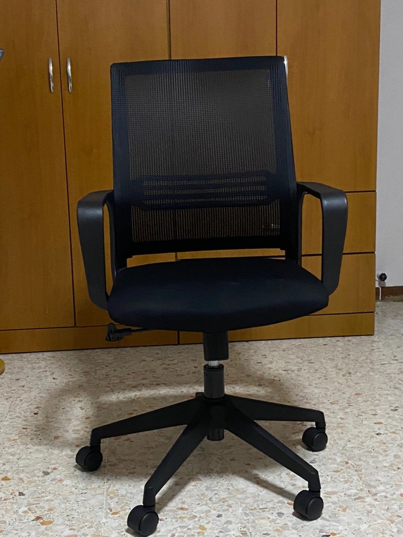 Best Ergonomic Chairs In Singapore - Chair in front of cupboard 