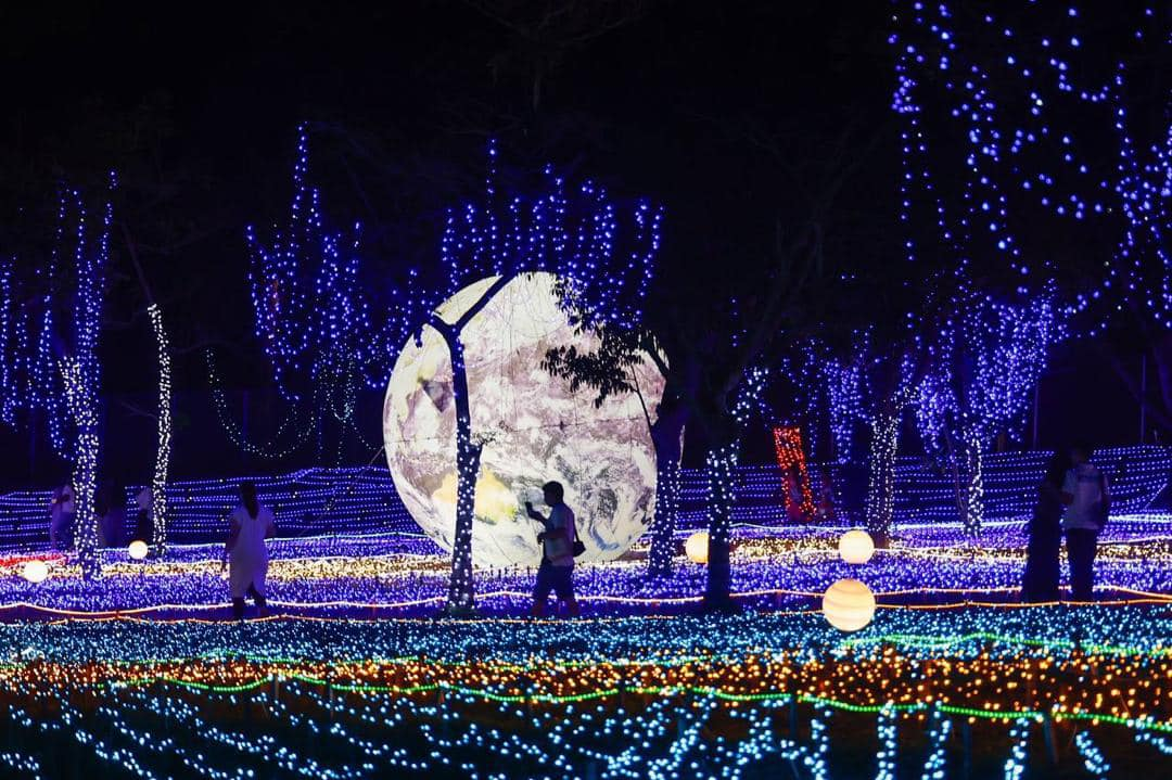 Luna Lights Wonderland - man walking amidst lights