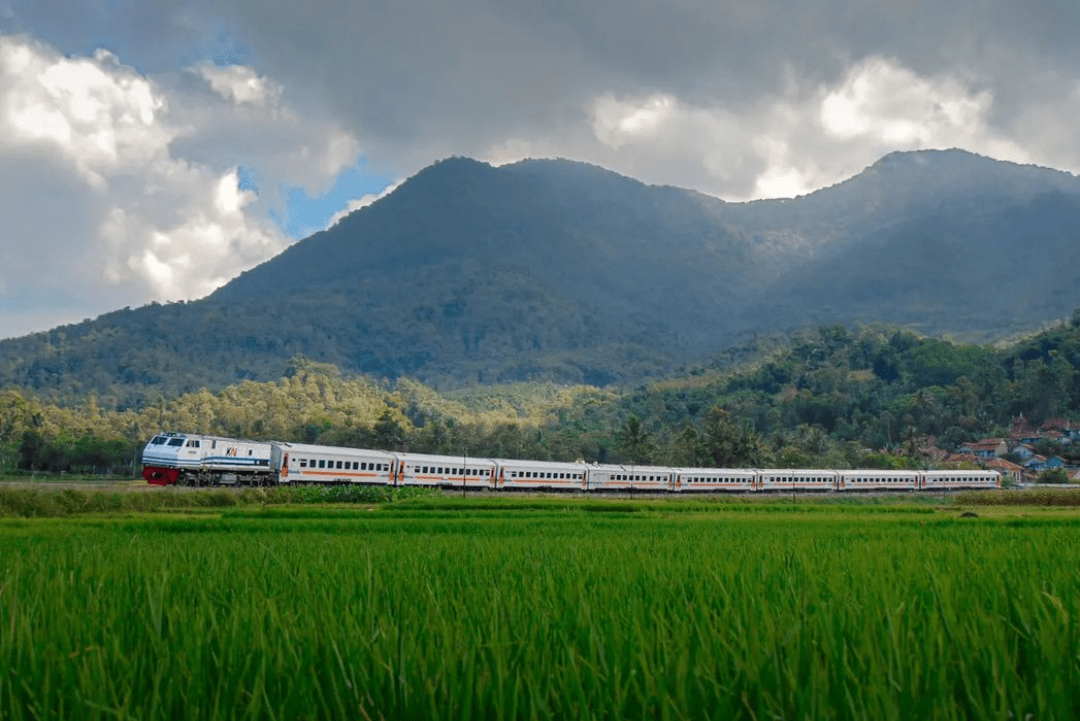 Train passing by mountains in Indonesia