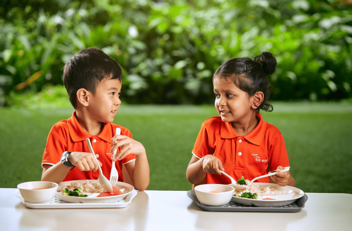 Having meals with peers - Preschools in Singapore