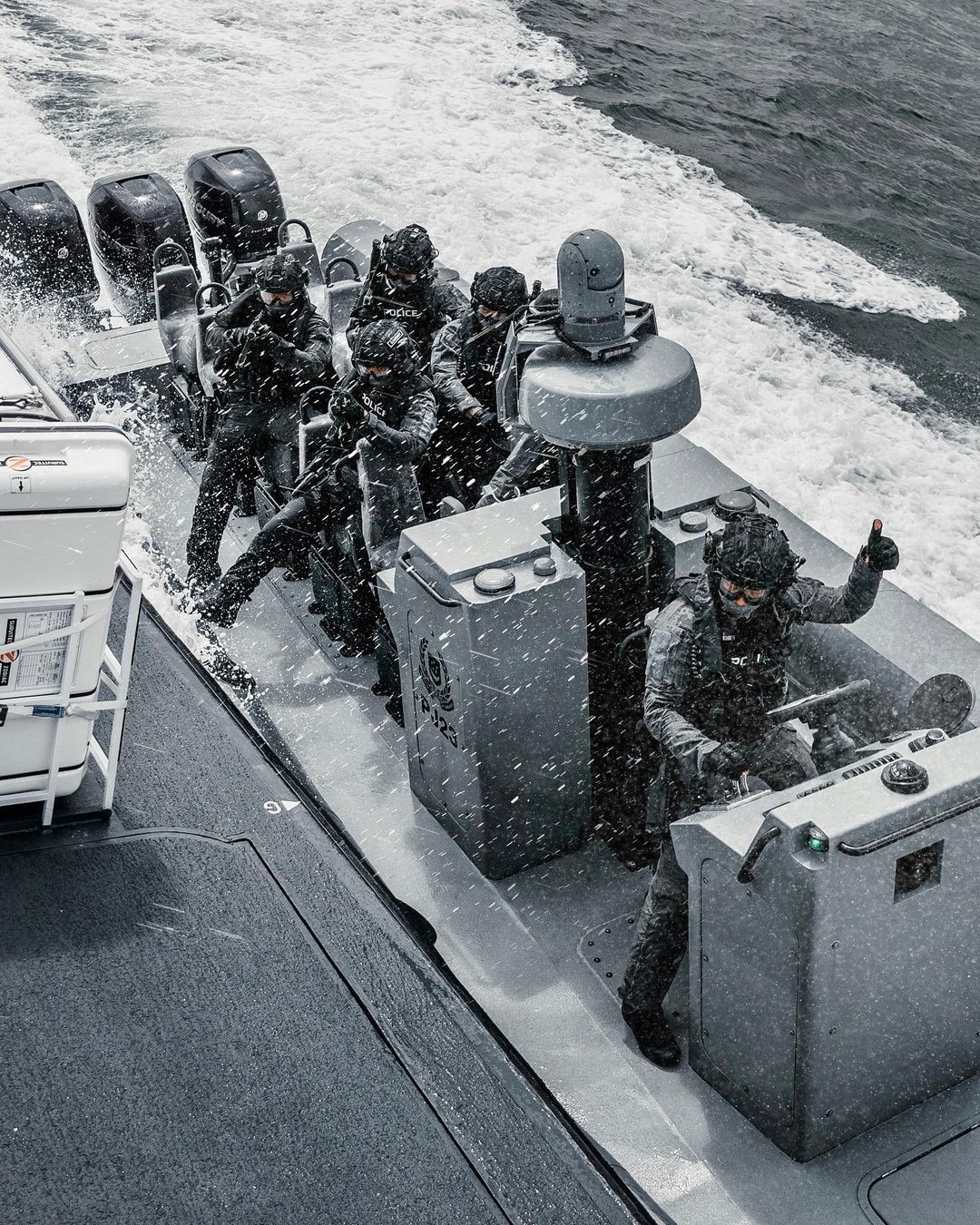 PCG Officers on a boat - Singapore police force