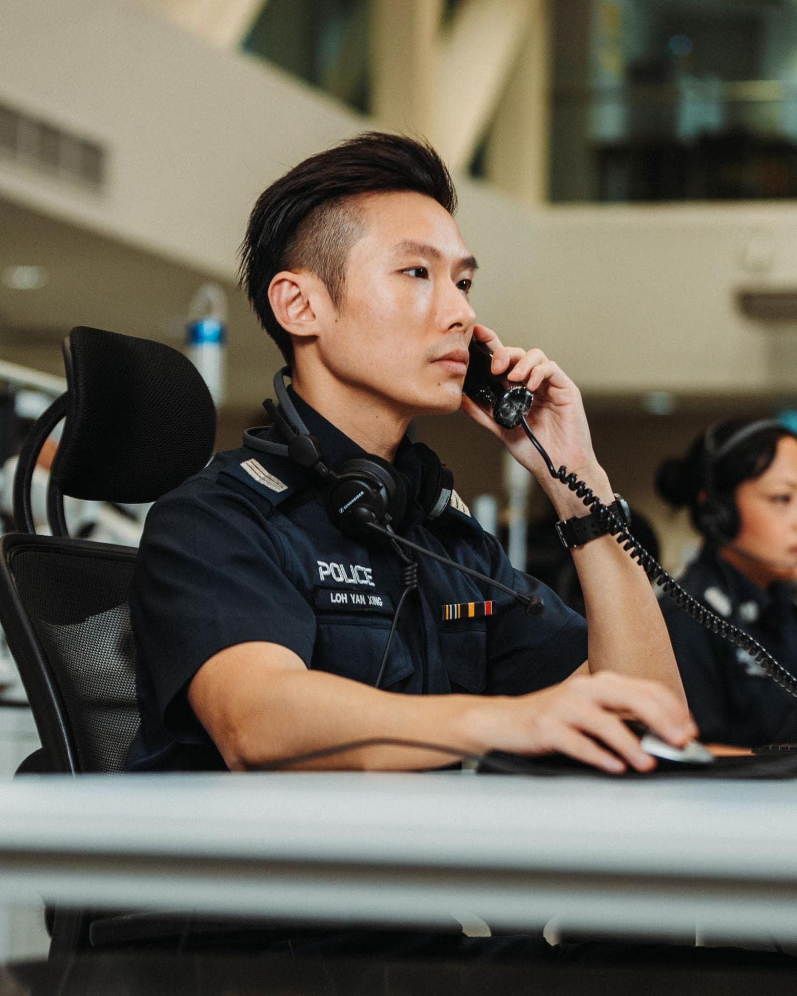 Policeman answering a call - Singapore police force