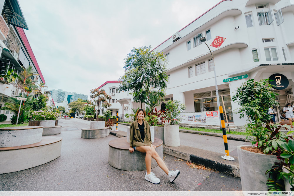 talent perched on seat near Sentosa Island 