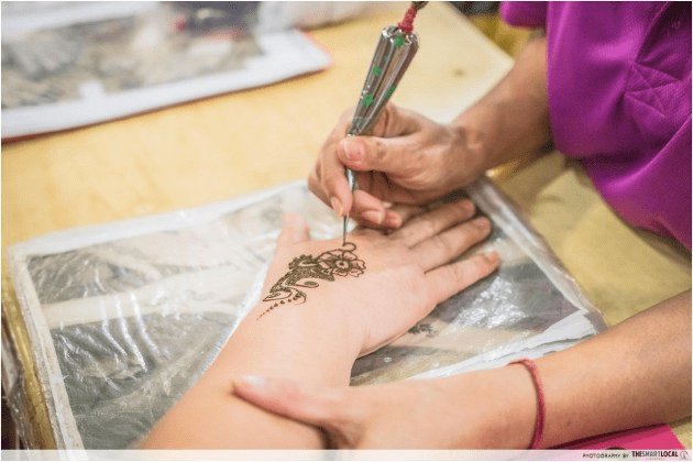 Getting henna at Little India Arcade