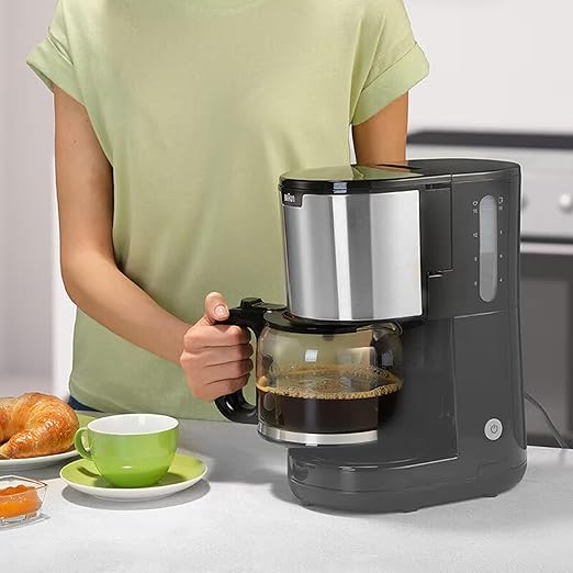 Braun Household PurShine KF 1500 dispensing coffee into a kettle 