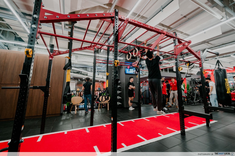 tall guy in Singapore - hanging from pull-up bar to be taller 