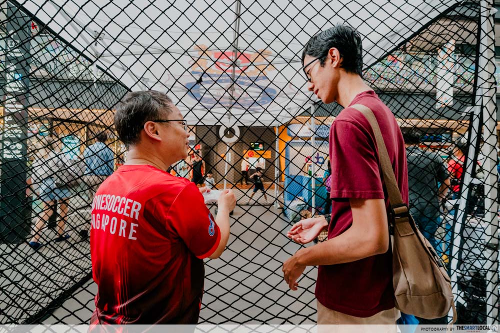 tall guy in Singapore - taller guy looking down on a shorter person 