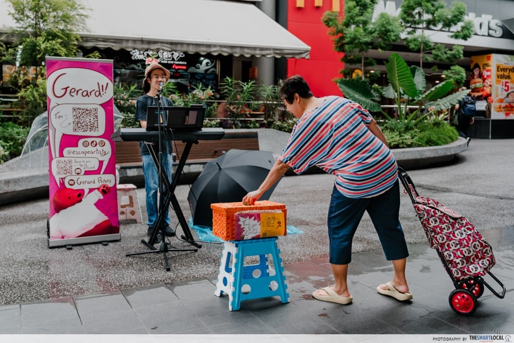 Donating to Gerard - Busking