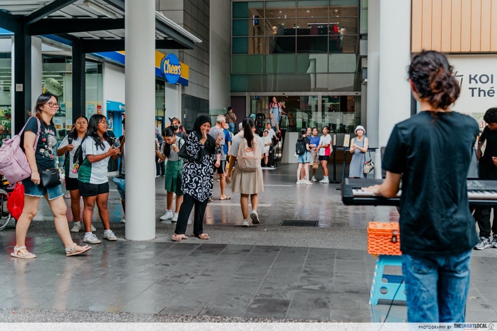 Onlookers appreciating Gerard's performance - Busking