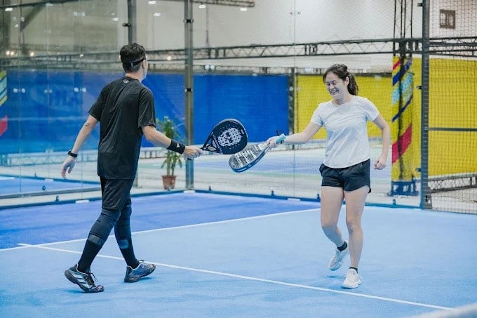 Couple playing pickleball