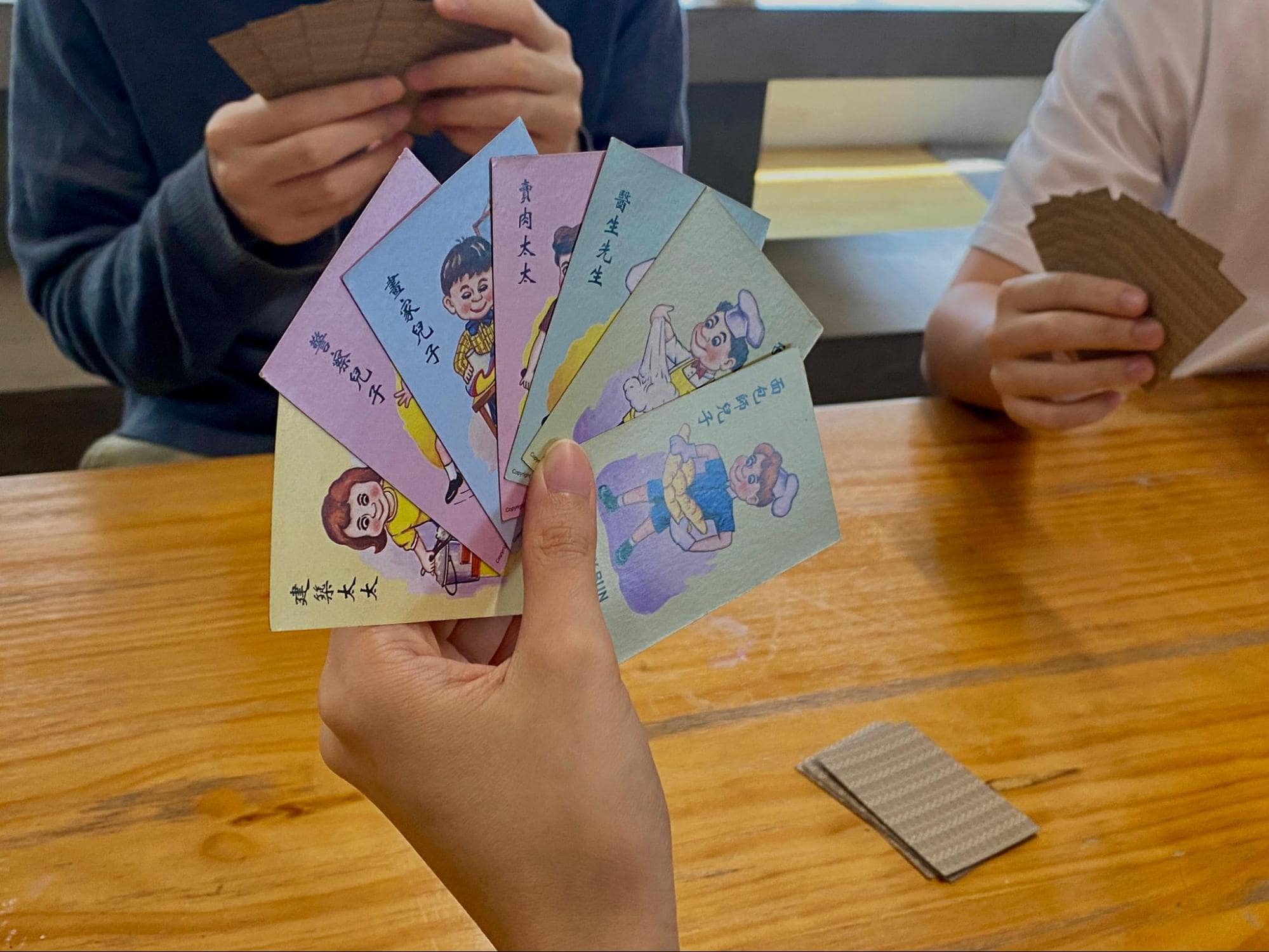 Card and board games - a player's hand in a game of Happy Family