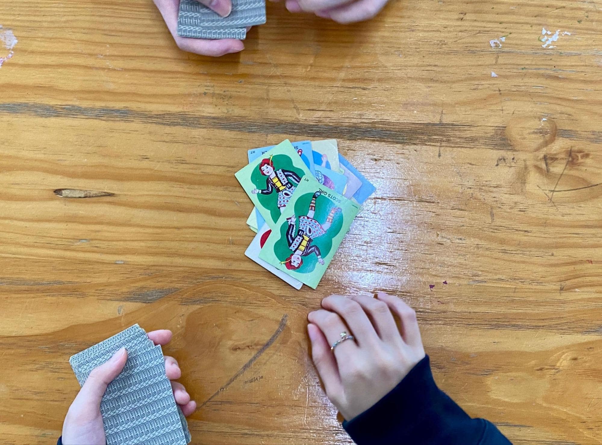 Card and board games - top down view of a snap game between two people
