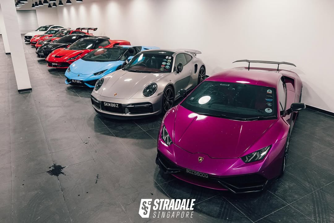 Carlogy Malaysia - A row of sports cars parked in the facility
