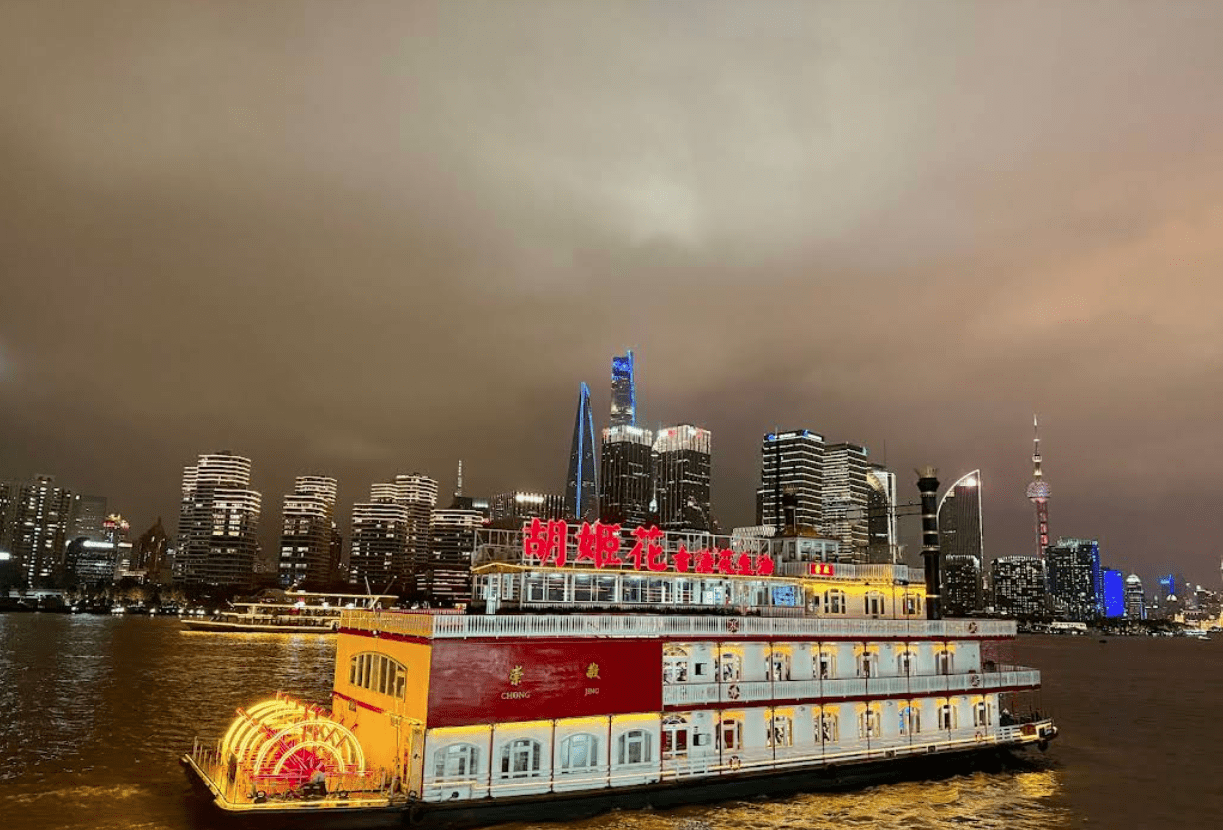 Shanghai Itinerary - view of the Huangpu River with a cruise in the foreground