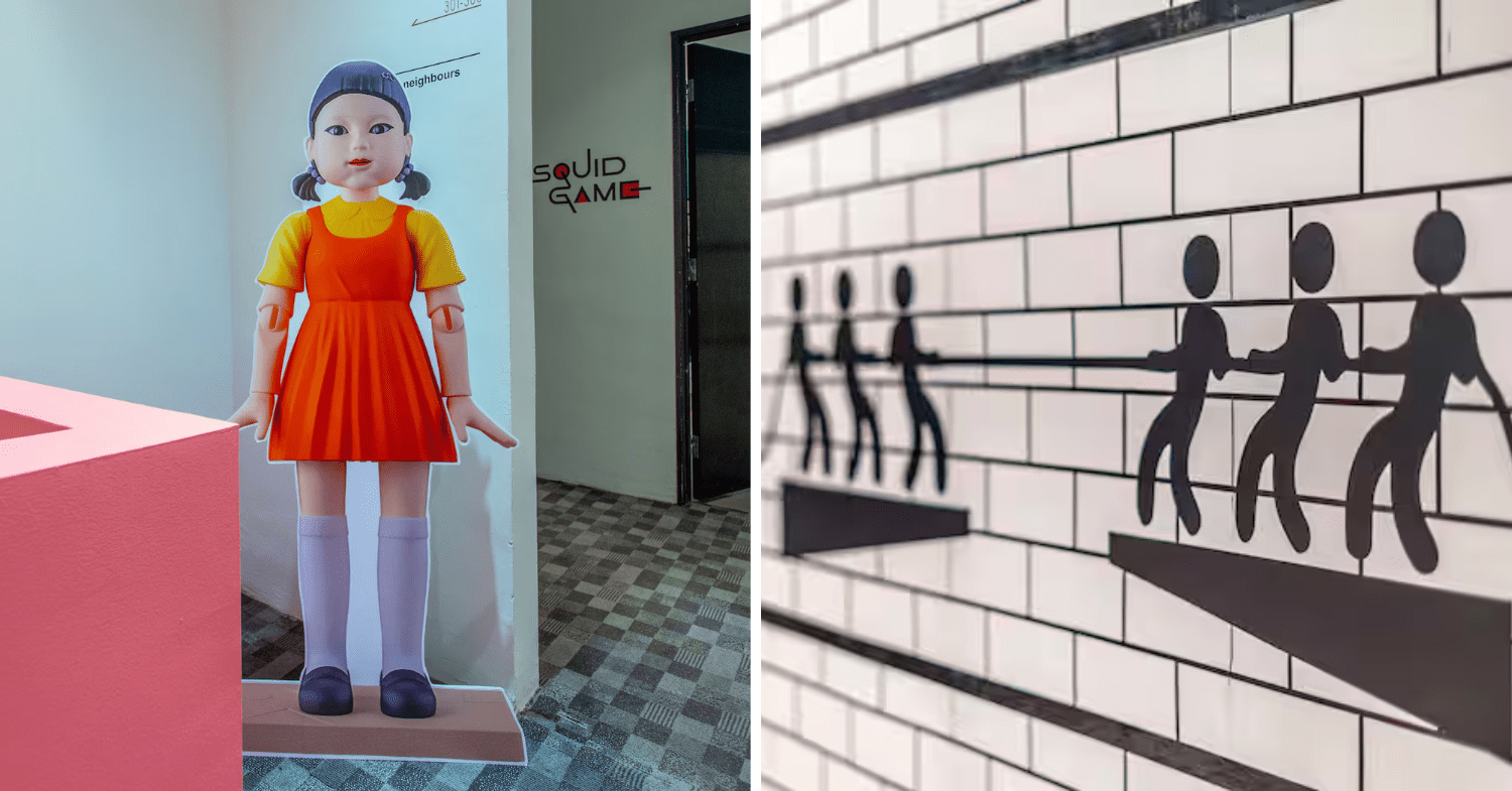 Squid Game Airbnb - Red light green light doll at the front desk and wall decals in the room