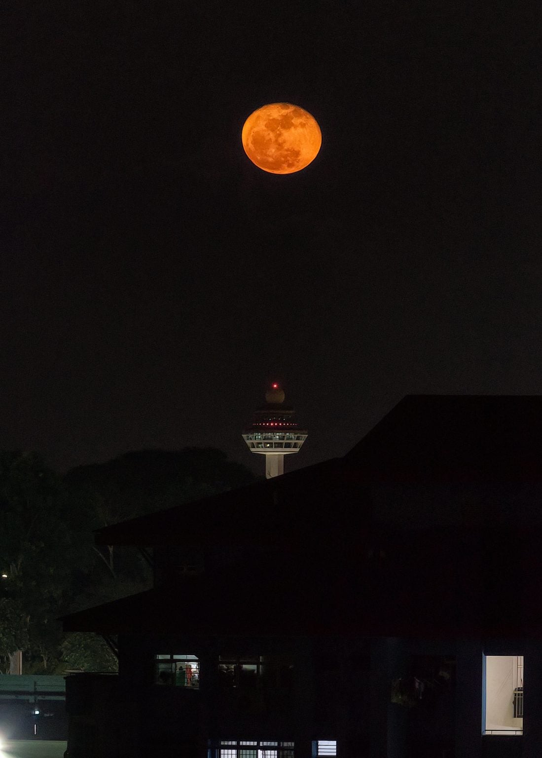 Supermoon in Singapore over the Changi Tower