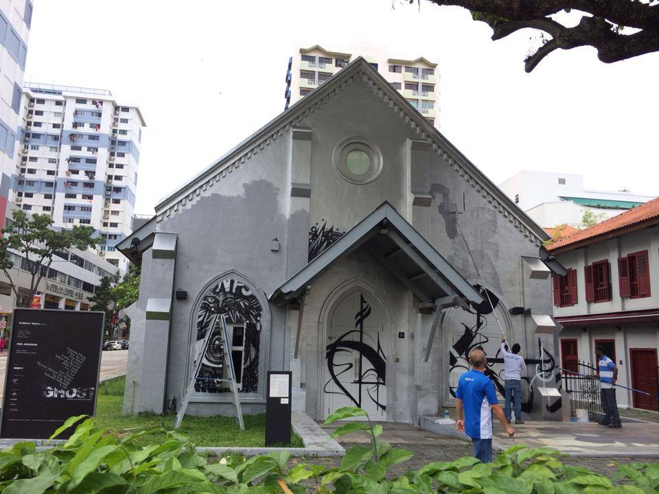 arts spaces - repainting works outside of the Sculpture Square after an exhibition ended