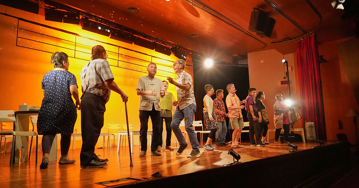 a group of seniors trying out acting on stage