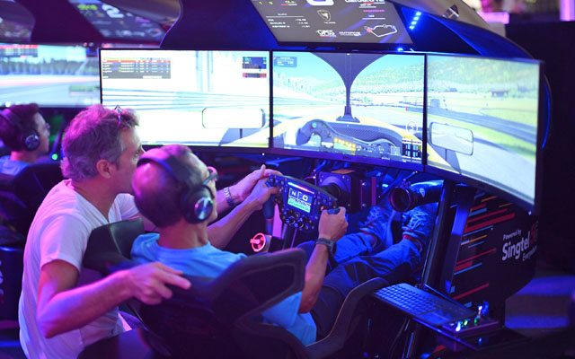 Person playing racing sim