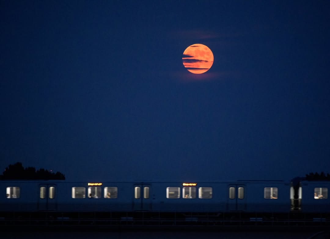 Beaver Moon partially covered by clouds
