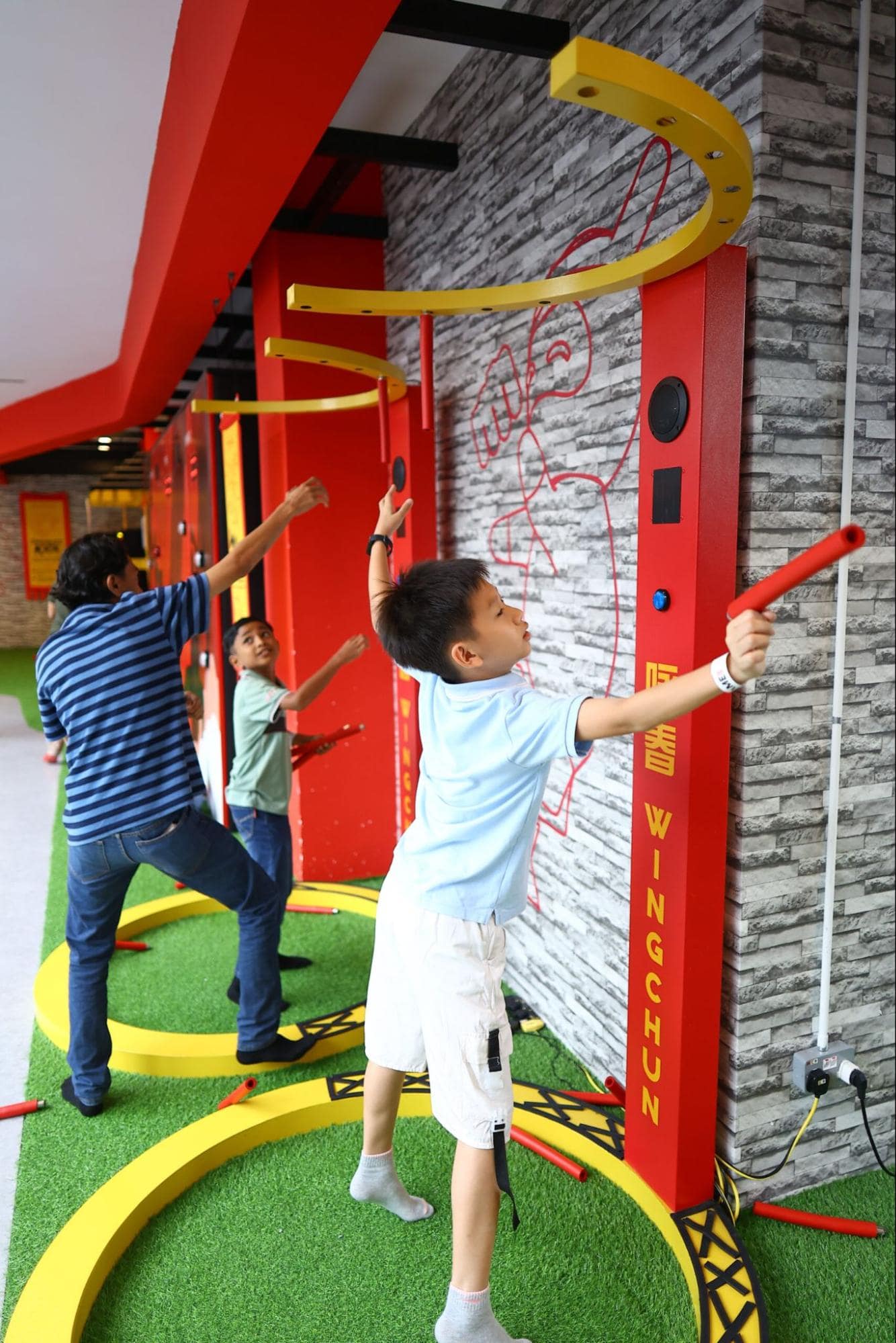 Catching sticks game in Kung Fu District at Game On Sports Hub