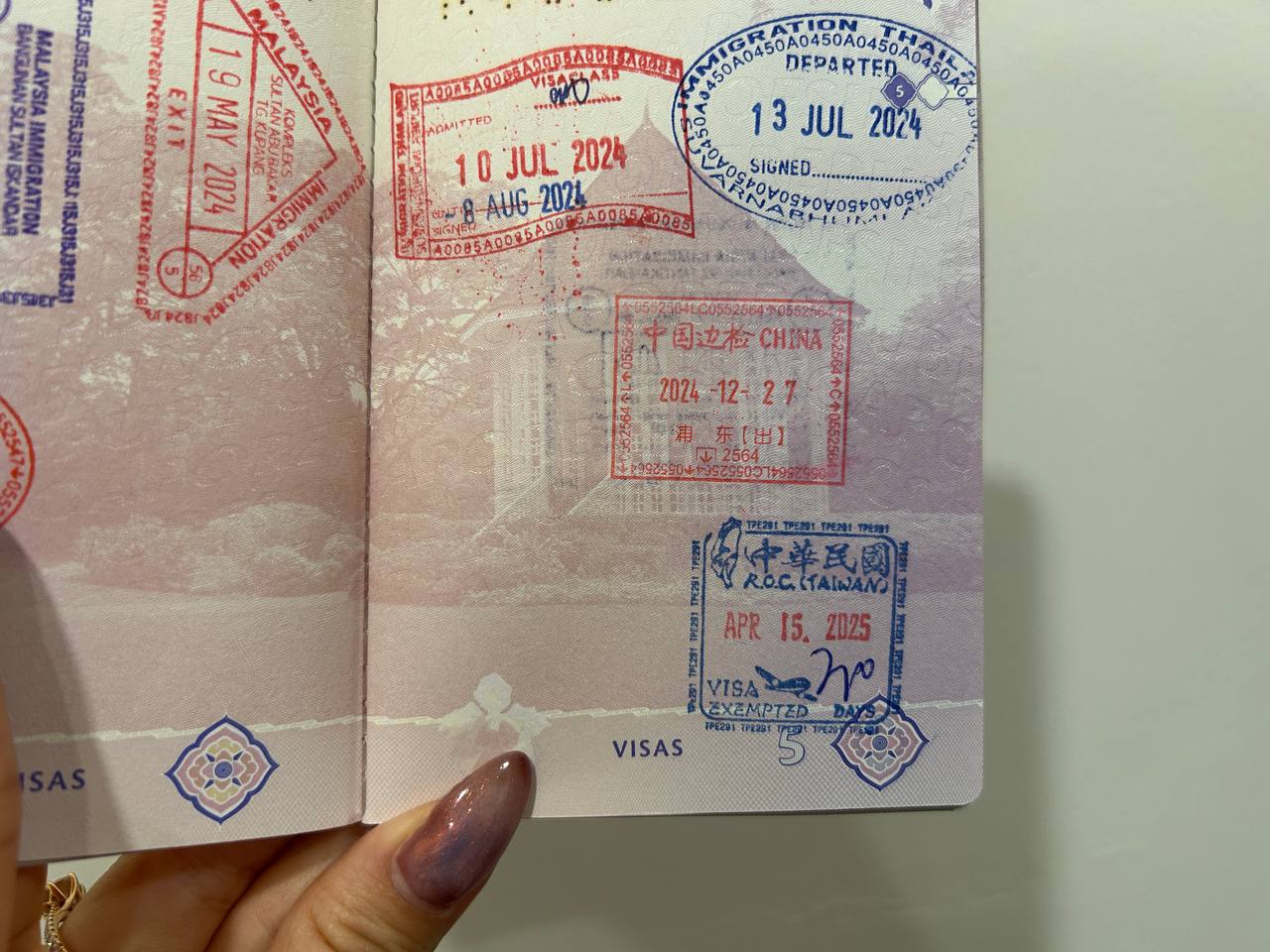 Passport stamps from Thailand, China, and Taiwan