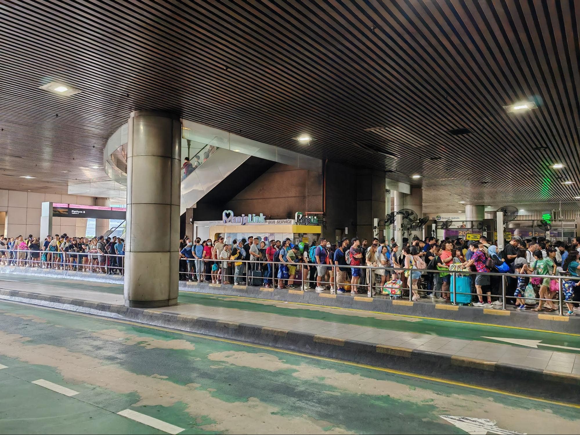 Walking across the SG-JB Causeway - bus queue