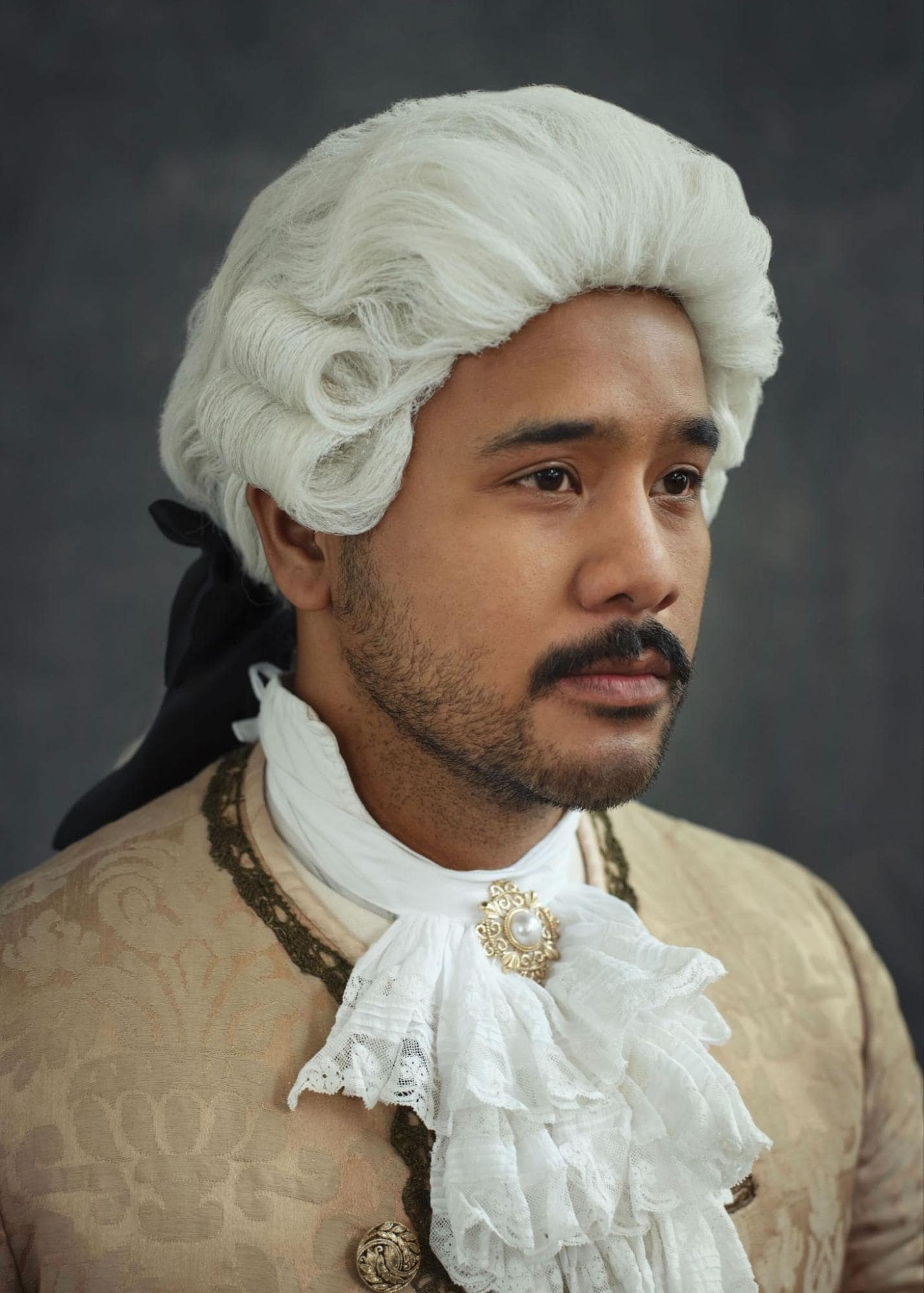 light to night - Zaki Hussain in a silly colonial-era outfit