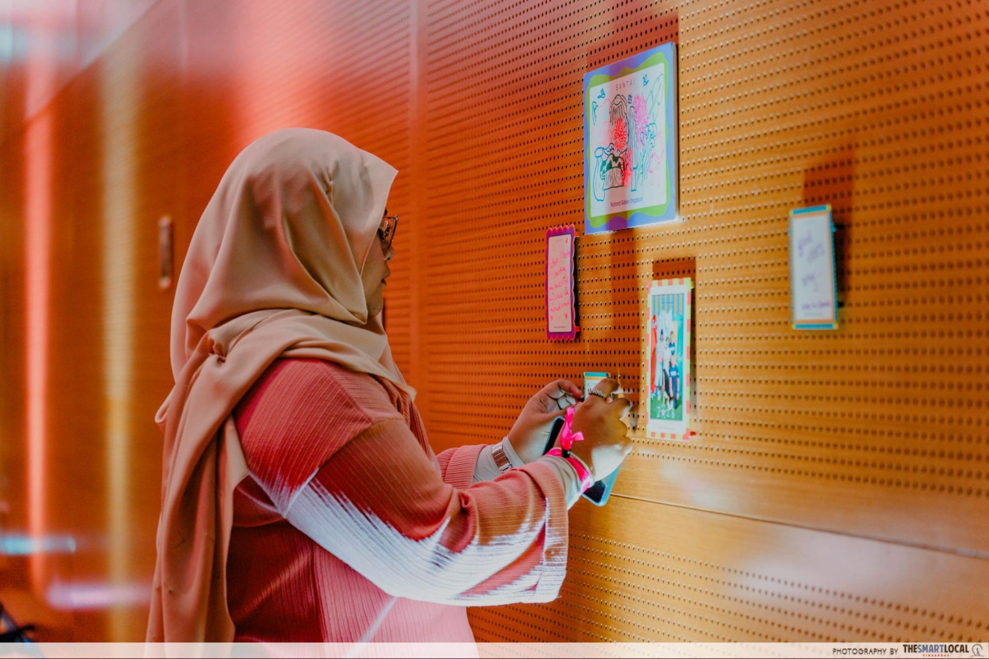 Wall of writings and drawings at SANTAI by visitors