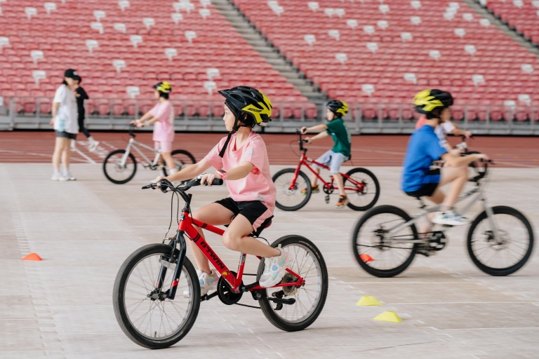 Kid learning how to ride a bike