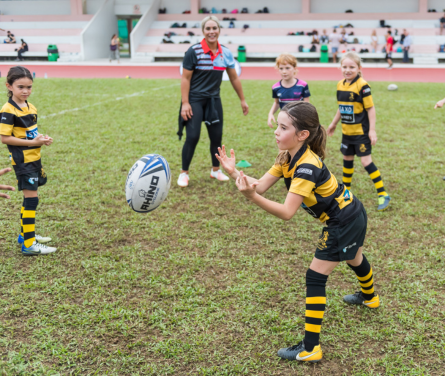 Kid playing rugby