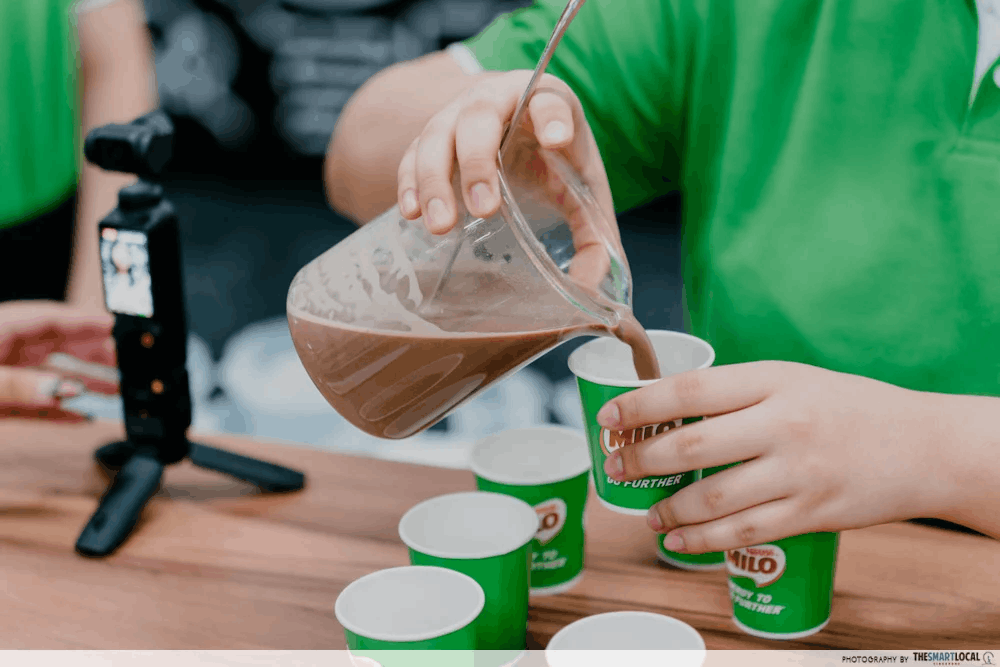 Pouring MILO into a cup