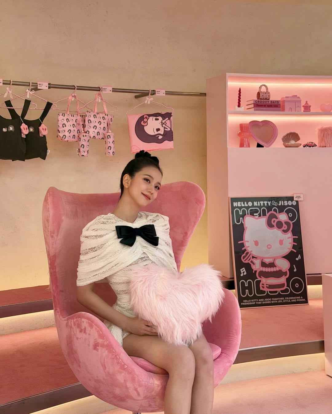 Jisoo posing with her Hello Kitty collab merch
